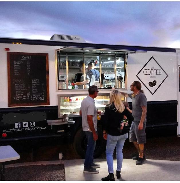 Truck serving customers at an evening event